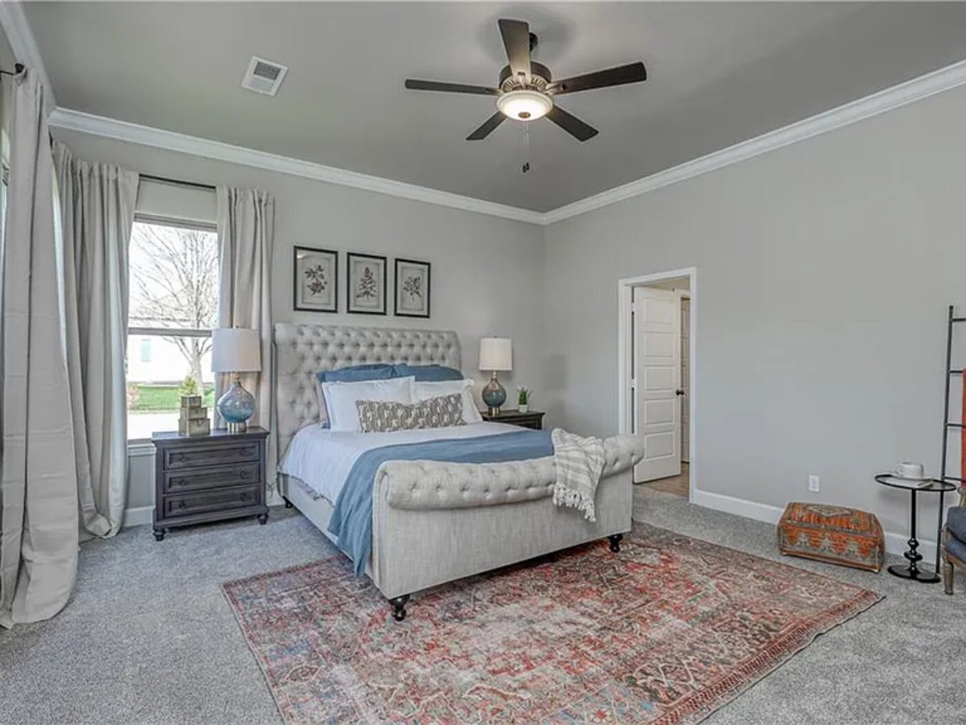 A resident bedroom with natural light and comfortable furnishings